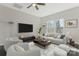 Spacious living room with modern furnishings, bright windows, and ceiling fan at 511 Roberts St, Shelby, NC 28150
