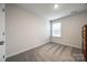 Bright bedroom with neutral carpet, a window, and fresh paint at 522 Trading Post Ln, York, SC 29745