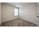 Cozy bedroom with soft carpeting, a window, and neutral color scheme at 522 Trading Post Ln, York, SC 29745