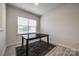Dining room featuring a dark wood table, modern flooring, and a bright window, perfect for Gathering meals and entertaining guests at 522 Trading Post Ln, York, SC 29745