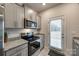 Kitchen with stainless steel appliances, granite countertops, and door leading to the backyard at 522 Trading Post Ln, York, SC 29745