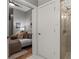 Bedroom view to bathroom featuring a glass shower stall at 525 E 6Th St # 211, Charlotte, NC 28202