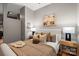 Neutral bedroom with hardwood-style flooring, bedside lamps, and stylish accent pillows at 525 E 6Th St # 211, Charlotte, NC 28202