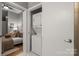 Bedroom view to laundry area with stacked washer and dryer in closet at 525 E 6Th St # 211, Charlotte, NC 28202