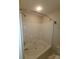 A full bathtub and shower combo with a shower head and white tub at 5963 Moose Ln, Charlotte, NC 28269