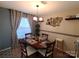 Cozy dining room with window, chandelier, and wall decor at 5963 Moose Ln, Charlotte, NC 28269