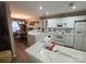 Bright kitchen featuring white cabinetry, marble countertops, and modern appliances at 5963 Moose Ln, Charlotte, NC 28269