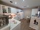 Bright kitchen featuring white cabinetry, marble countertops, and modern appliances at 5963 Moose Ln, Charlotte, NC 28269