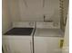 Efficient laundry area featuring a white, side-by-side washer and dryer set at 5963 Moose Ln, Charlotte, NC 28269