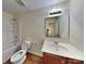Bathroom featuring a single vanity, toilet, and shower-tub combination at 600 Hunley St, Monroe, NC 28112