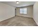Large bedroom offering neutral walls, carpet flooring, and a bright window at 600 Hunley St, Monroe, NC 28112
