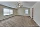 Spacious bedroom with a vaulted ceiling, carpeted floor, and bright windows at 600 Hunley St, Monroe, NC 28112