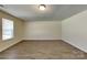 Bright bedroom with wood-look flooring and a window creating an inviting space at 600 Hunley St, Monroe, NC 28112