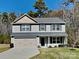 Charming two-story home with a two-car garage and well-manicured lawn at 600 Hunley St, Monroe, NC 28112