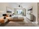 This bedroom features a neutral color palette, stylish furnishings, and a ceiling fan at 6084 Diamond Pl, Harrisburg, NC 28075