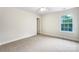 Neutral bedroom features carpet flooring and a window providing natural light at 6084 Diamond Pl, Harrisburg, NC 28075