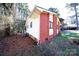 A brick and vinyl house surrounded by a wooded yard at 6245 Snowcrest Ct, Charlotte, NC 28212