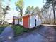 Side view of a home featuring brick accents and a concrete driveway at 6245 Snowcrest Ct, Charlotte, NC 28212