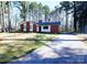Charming single story home boasts a front yard and long drive at 6245 Snowcrest Ct, Charlotte, NC 28212