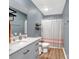 Bathroom features a white vanity with a marble countertop, a toilet, and a shower with a patterned curtain at 629 Gants Rd, York, SC 29745