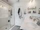 Updated bathroom with double sinks, a walk-in glass shower, and convenient shelving for toiletries at 629 Gants Rd, York, SC 29745