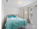 Bright bedroom with a bed that has a blue comforter, and a window with natural light coming through it at 629 Gants Rd, York, SC 29745