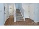 Inviting entryway showcasing the staircase with grey carpet and a stylish, light-filled interior at 629 Gants Rd, York, SC 29745
