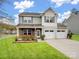 Charming two-story home with a well-manicured lawn and a two-car garage, perfect for Gathering living at 629 Gants Rd, York, SC 29745