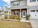 Charming front exterior with stone accents, covered porch, two-car garage, and well-manicured landscaping at 629 Gants Rd, York, SC 29745