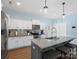 This kitchen boasts an island with seating, lots of counterspace, and stainless appliances at 629 Gants Rd, York, SC 29745