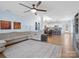 Open-concept living room flows into a modern kitchen, featuring a large ceiling fan and lots of light at 629 Gants Rd, York, SC 29745