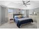 Relaxing main bedroom with tray ceiling, a ceiling fan, large windows, and stylish decor at 629 Gants Rd, York, SC 29745