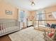 Bright Bedroom with a crib, toddler bed, and plenty of natural light from the windows at 638 Forest Ln, Rock Hill, SC 29730