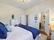 Sun-filled bedroom with en-suite bathroom, hardwood floors, and a queen-size bed at 638 Forest Ln, Rock Hill, SC 29730