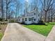 White, two-story home with an attached porte-cochère and large driveway at 638 Forest Ln, Rock Hill, SC 29730