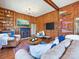 Wood-paneled living room featuring a fireplace, built-in shelving, and comfortable seating at 638 Forest Ln, Rock Hill, SC 29730