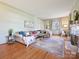 Bright living room with hardwood floors, light green walls, and a decorative rug at 638 Forest Ln, Rock Hill, SC 29730