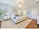 Bright main bedroom with a large window, hardwood floors, and a white area rug at 638 Forest Ln, Rock Hill, SC 29730
