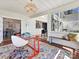 Bright sunroom with a red desk, colorful rug, and natural light at 638 Forest Ln, Rock Hill, SC 29730
