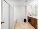 Clean bathroom features a shower over tub, a double sink vanity, and updated fixtures at 638 Nannyberry Ln, Concord, NC 28025