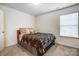 Comfortable bedroom with large window and neutral color palette at 638 Nannyberry Ln, Concord, NC 28025