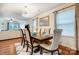 Open-concept dining area with hardwood floors, statement lighting, and modern decor at 638 Nannyberry Ln, Concord, NC 28025