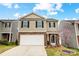 Charming two-story home with a welcoming front yard and a two car garage at 638 Nannyberry Ln, Concord, NC 28025