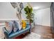 Inviting foyer with stylish decor, including a plush bench and eye-catching wall art at 638 Nannyberry Ln, Concord, NC 28025