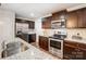 Close-up of the kitchen showcasing stainless steel appliances, granite countertops, and sleek cabinetry at 638 Nannyberry Ln, Concord, NC 28025