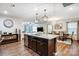 Open-concept kitchen island connects the cooking space to the dining and living areas, promoting a social atmosphere at 638 Nannyberry Ln, Concord, NC 28025