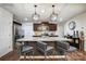 Spacious kitchen with granite counters, stainless steel appliances, stylish pendant lights, and ample cabinet space at 638 Nannyberry Ln, Concord, NC 28025