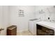 Convenient laundry room with modern washer and dryer and space-saving shelving at 638 Nannyberry Ln, Concord, NC 28025