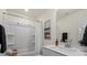 Well-lit bathroom featuring a shower-tub combination, white cabinets and modern fixtures at 6450 Keeton Ln, Harrisburg, NC 28075