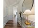 Bright hallway featuring hardwood floors, elegant wall trim and decor at 6450 Keeton Ln, Harrisburg, NC 28075